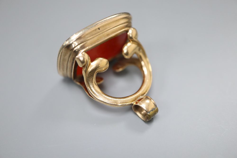 A 19th century gold (tests as 14ct) fob seal with intaglio-cut carnelian matrix, 30mm, gross 15.9 grams.